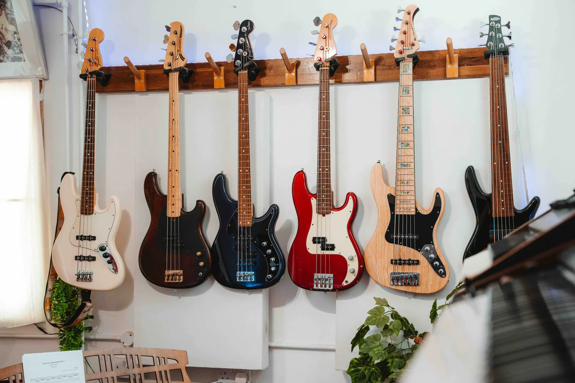 A wall of bass guitars