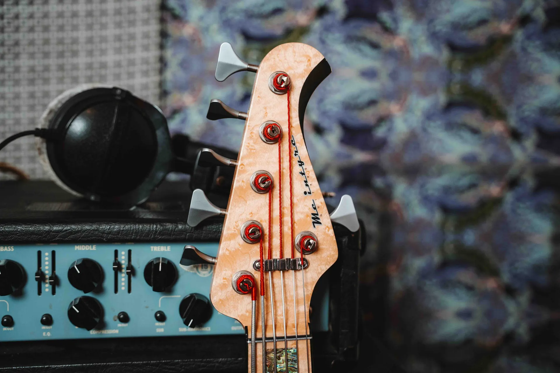 The headstock of a MacIntyre bass guitar